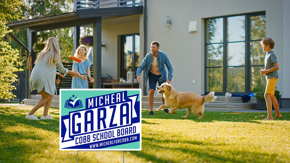 Image of yard sign in the forefront with a yard, house, and family playing with a dog in the background